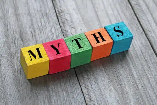 Colorful blocks spelling myths on wood surface