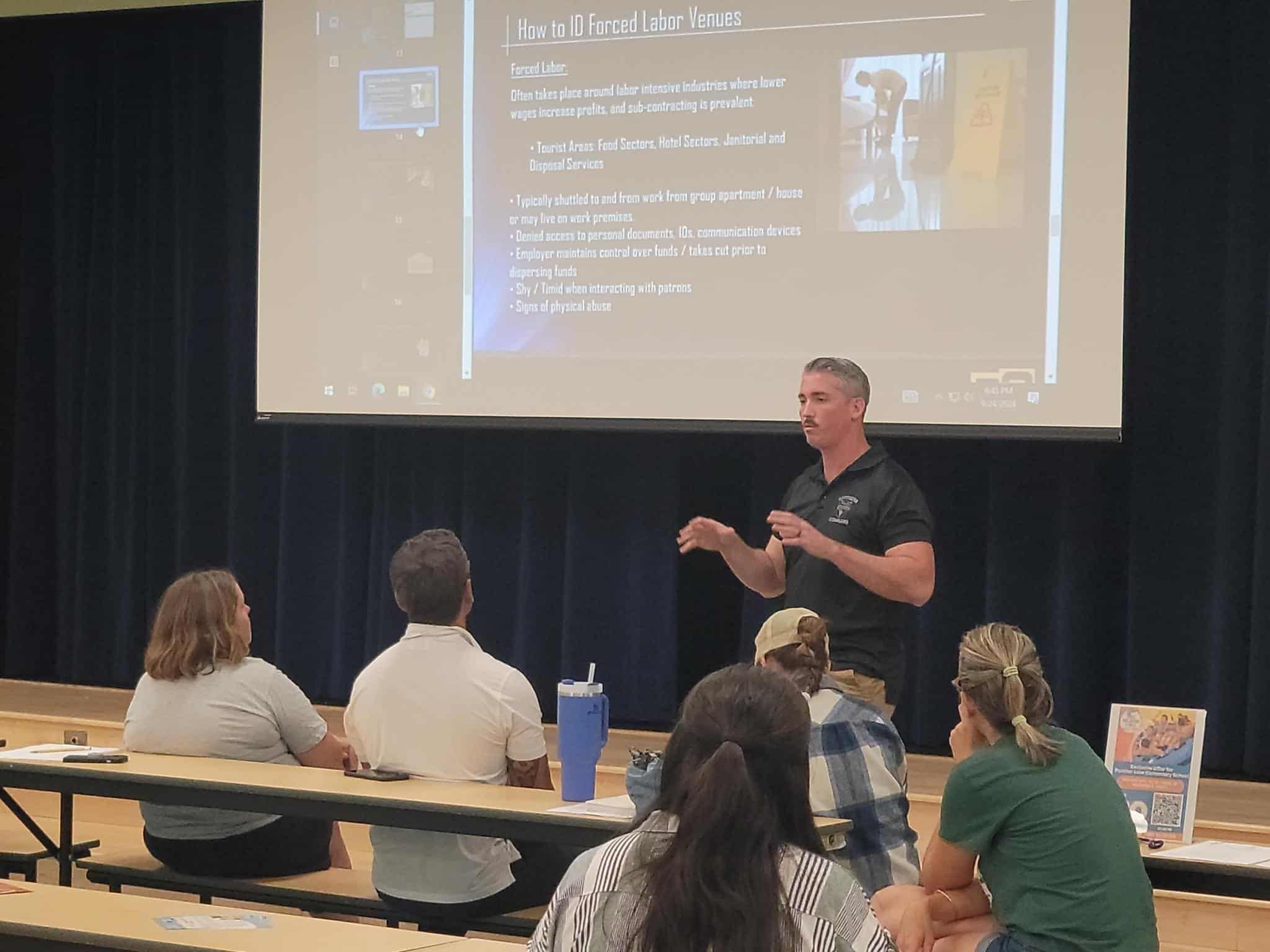 Instructor teaching a class on forced labor venues.