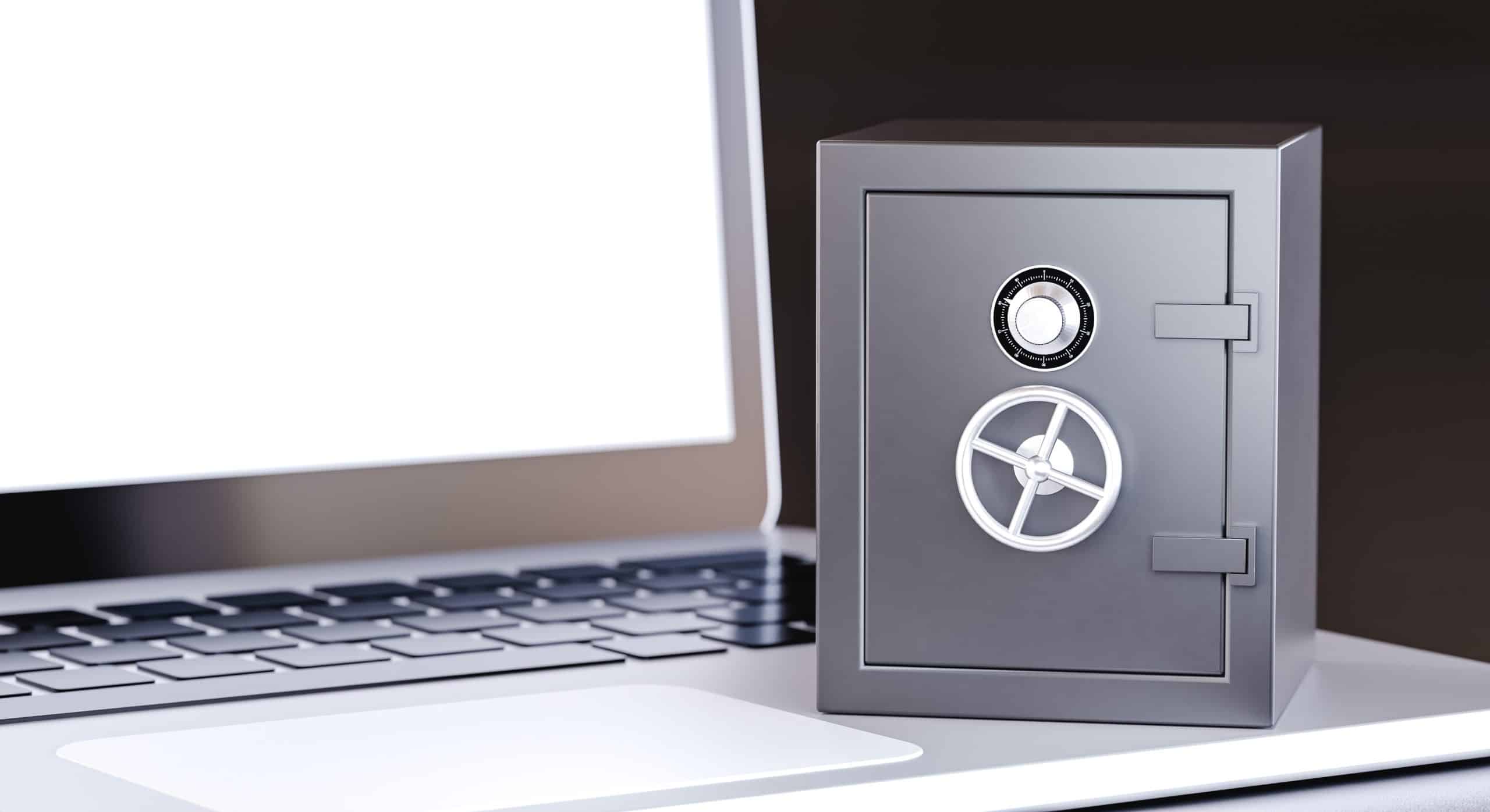 Laptop with a secure safe close by.