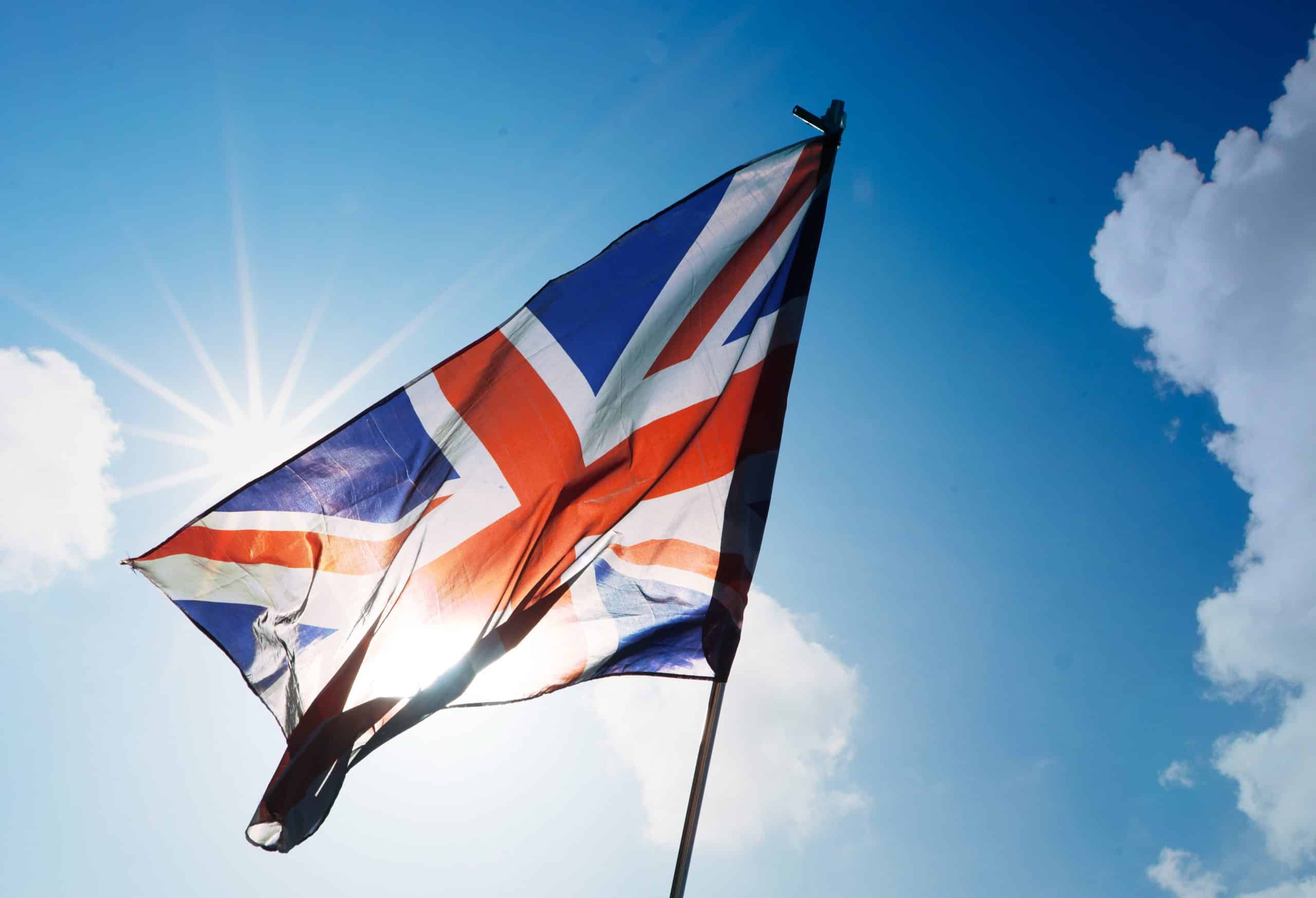 Union Jack flag against a bright sky